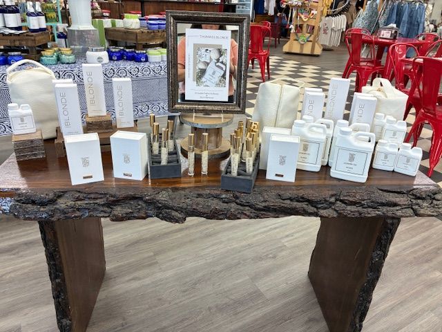 Thomas Blonde fragrance collection displayed on a wooden table at Center Drugs